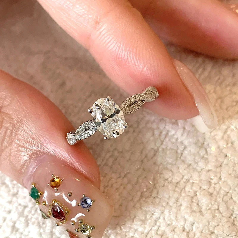 Diamond ring on a finger with a textured background